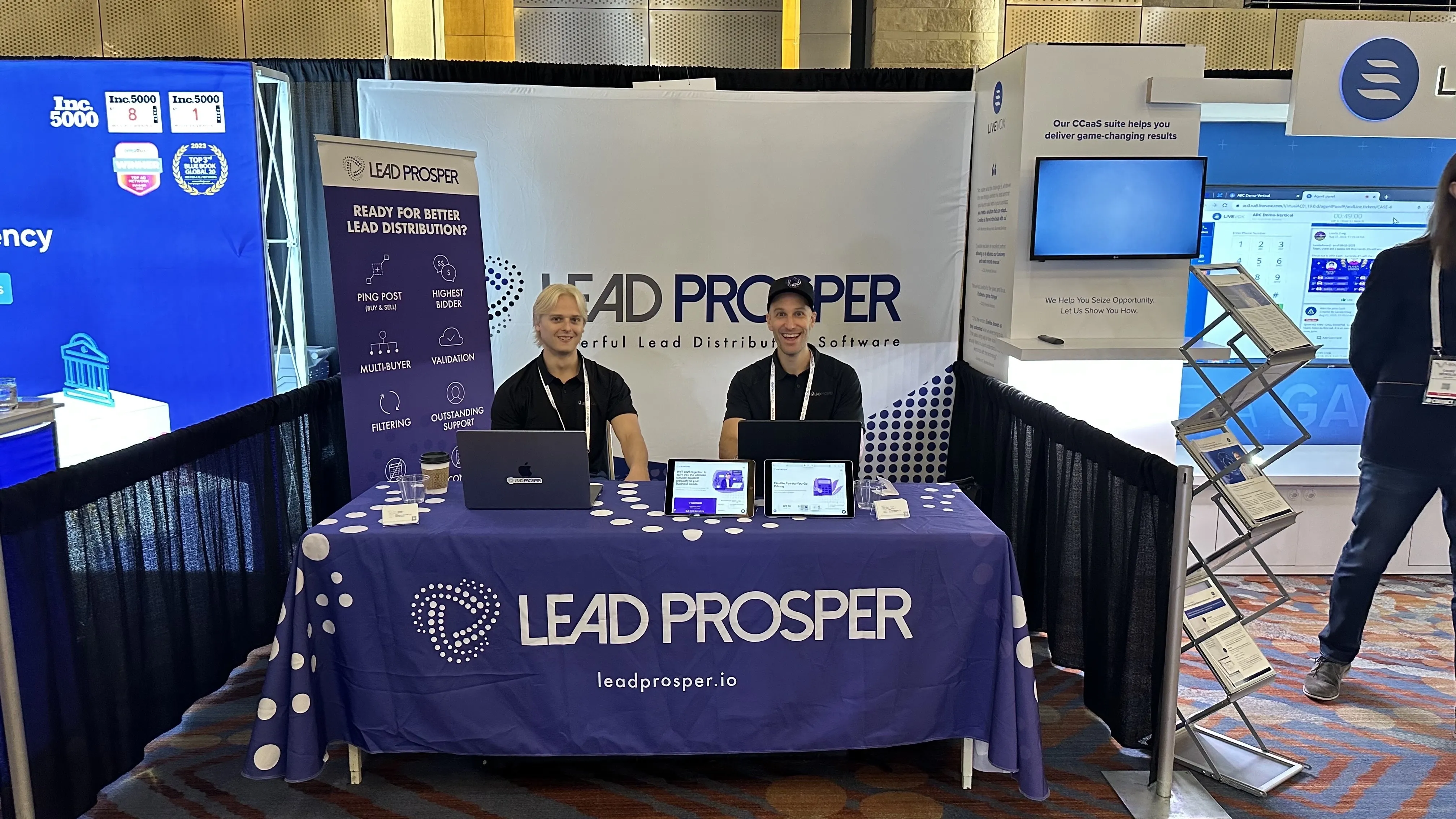 Lead Prosper’s Harrison Johnston (left) and Ross Breiman (right) show off their booth at Contact.io in Denver, Colorado.
